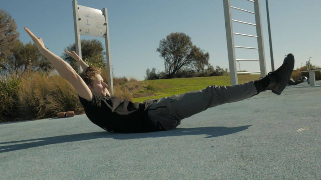 Man stretching on the ground outdoor