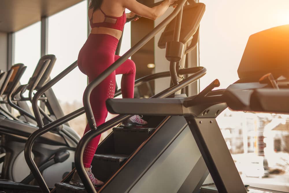 A person using the stair master in the gym