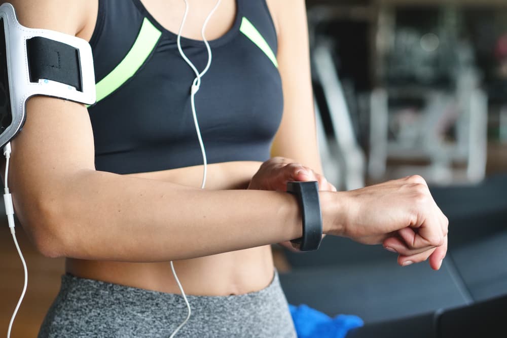 Woman monitoring her fitness tracker