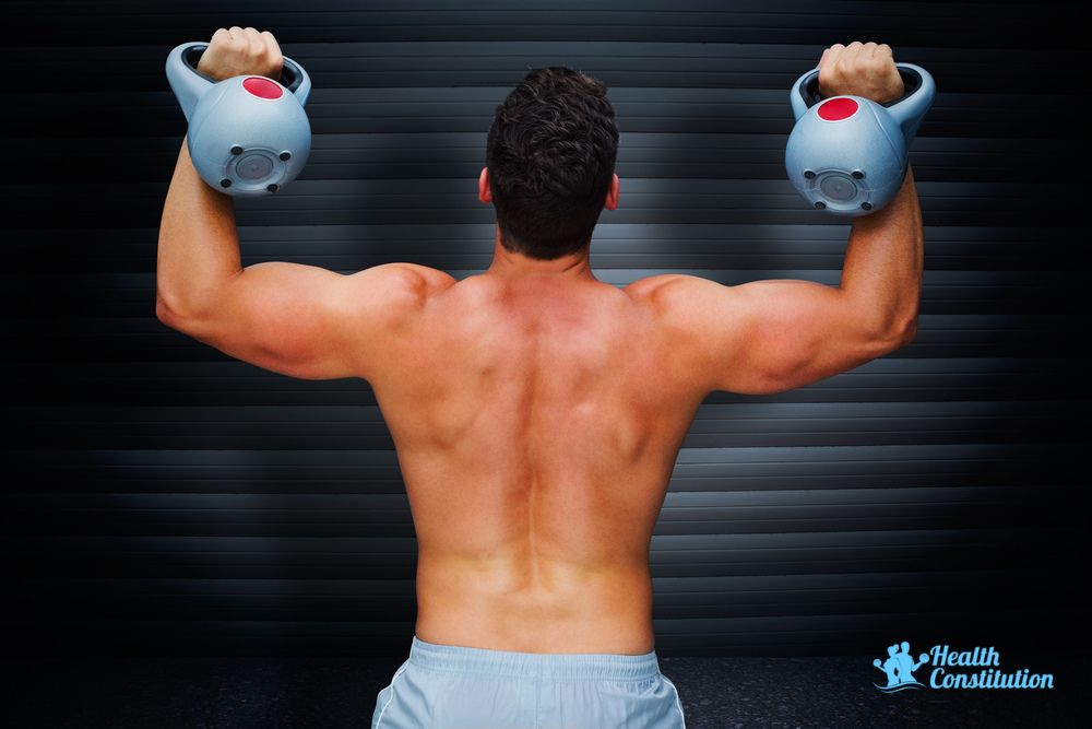 Man Lifting One Kettlebell On Each Arm