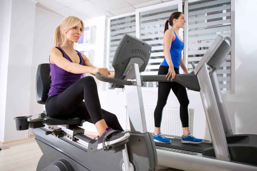 A lady using a recumbent bike