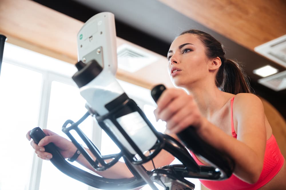 Woman Doing an Intense Cycling Session