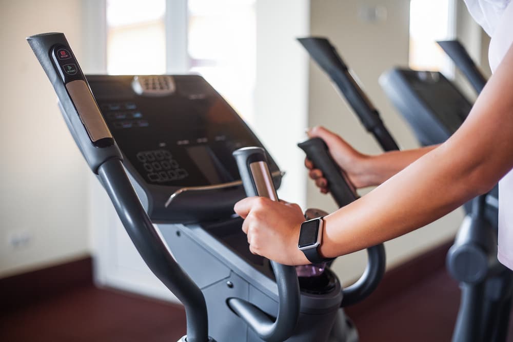 Woman with Pulse Sensor and Fitness Tracker While Cycling