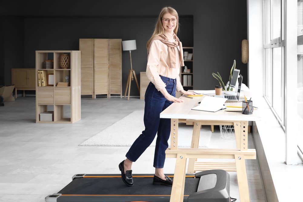 woman-setting-her-practical-treadmill-desk-station